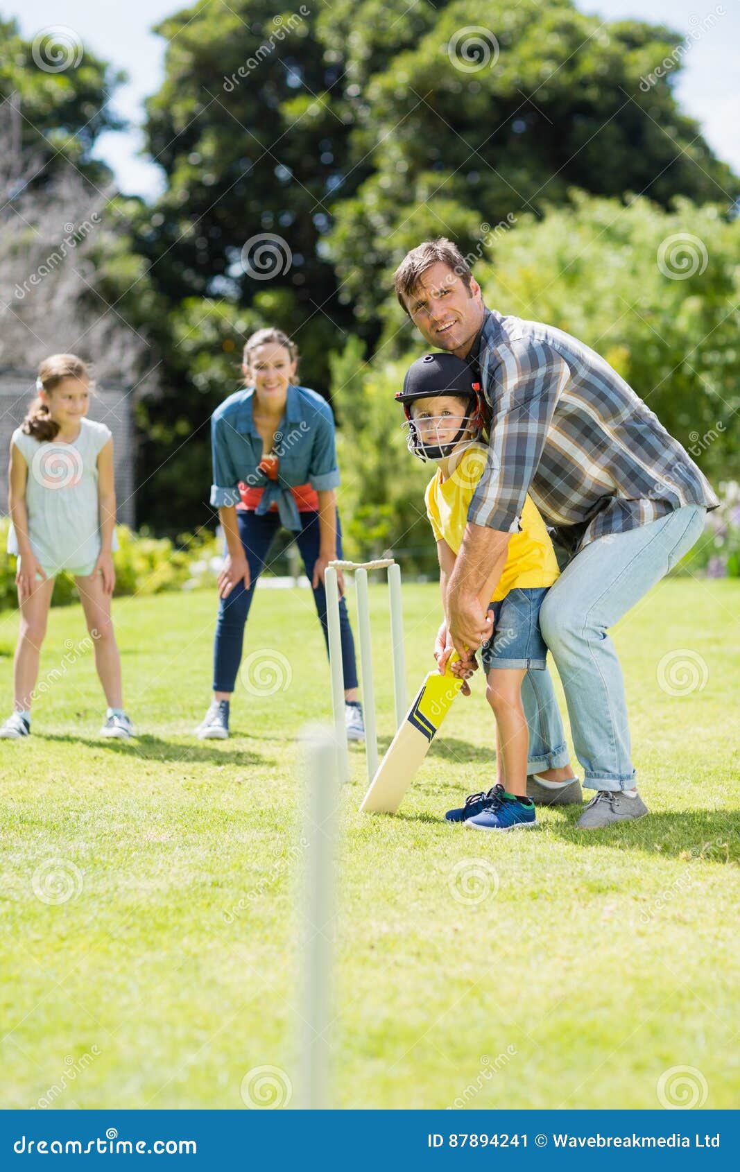 Happy Family Playing Cricket Together Stock Image Image of adorable