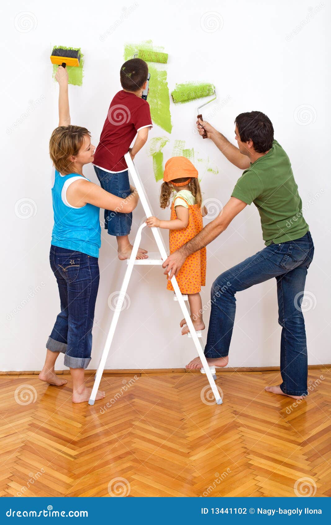 Happy Family Redecorating the House - Painting Stock Photo - Image ...