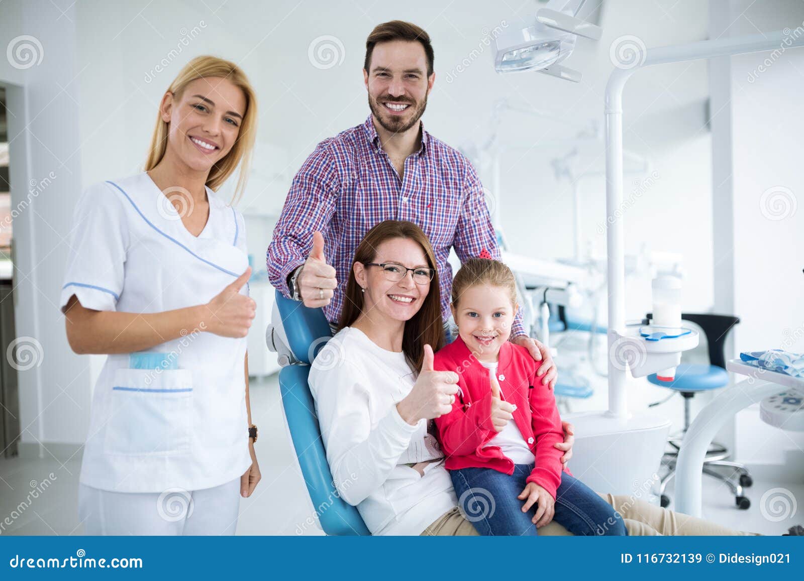 happy family with a smiling young dentist