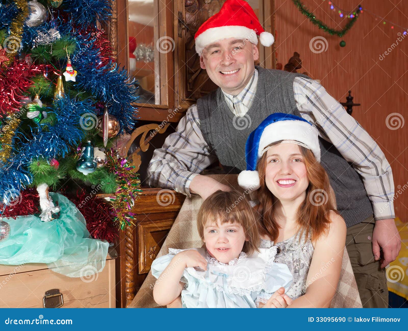 Happy Family of Three with Christmas Tree Stock Photo Image of