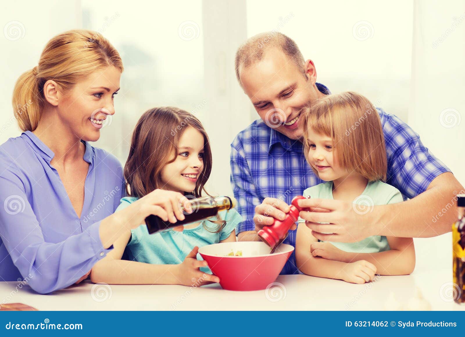 Happy Family with Two Kids Making Dinner at Home Stock Photo - Image of