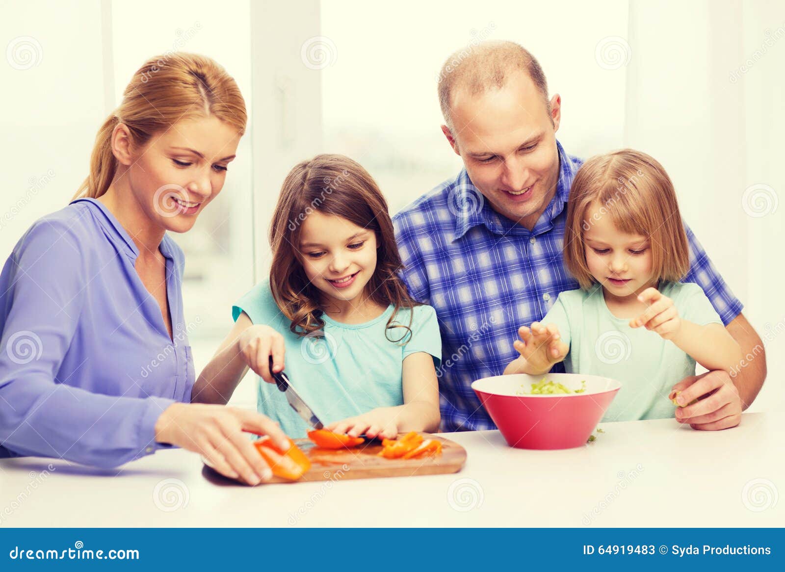 Happy Family With Two Kids Making Dinner At Home Stock Image - Image