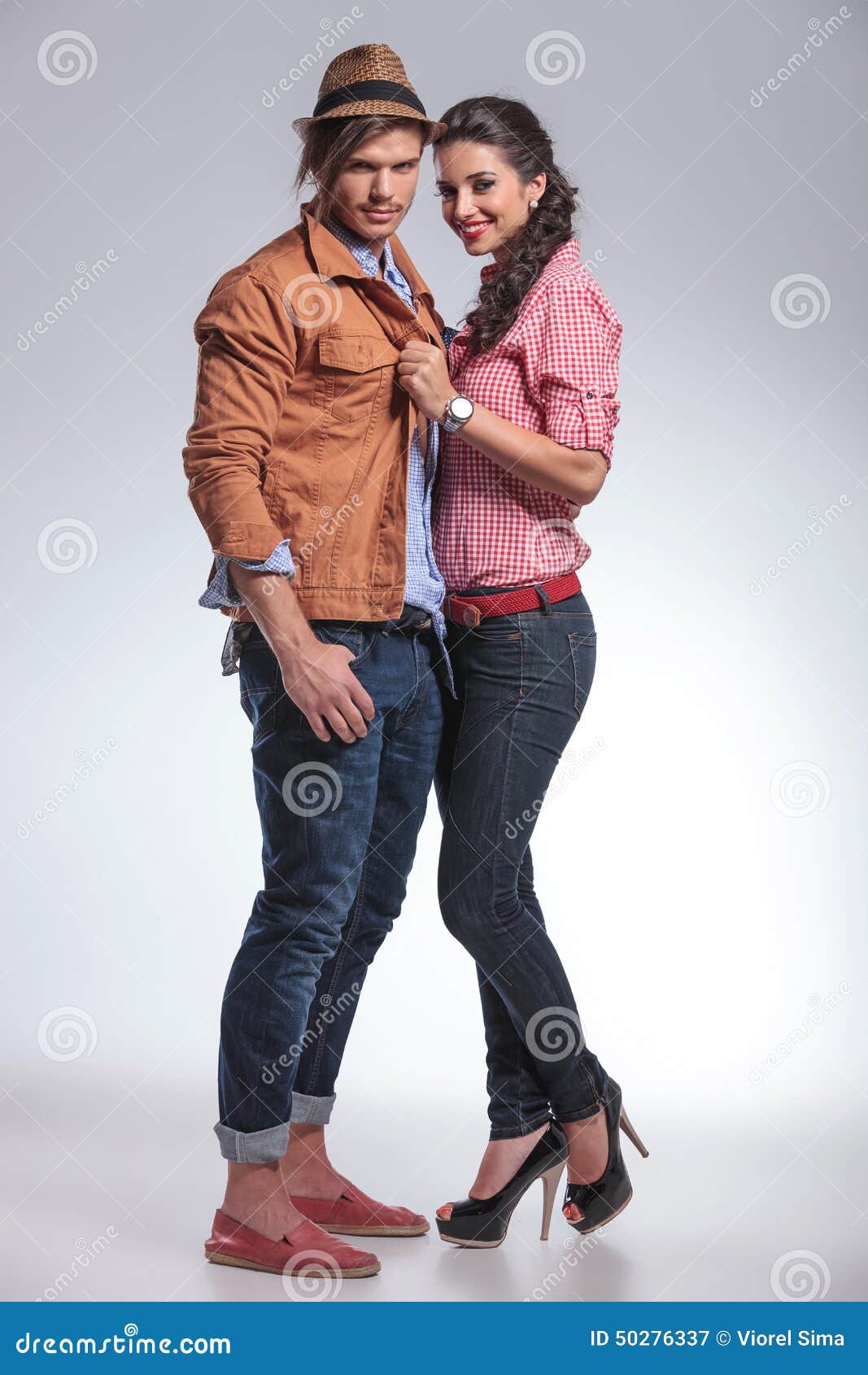 Fashion Couple in a Pose Looking To Their Side Stock Image - Image of hand,  attractive: 39546211