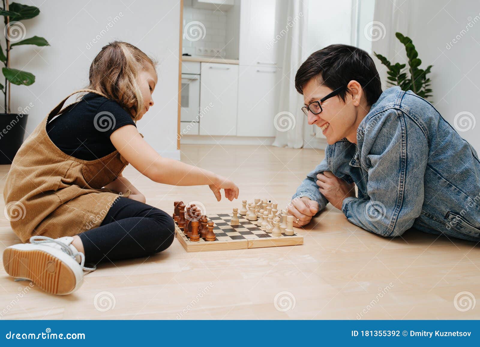 Daughter Picking Best Chess Moves For Parents While Playing Chess In  Mountain Cottage Stock Photo - Download Image Now - iStock