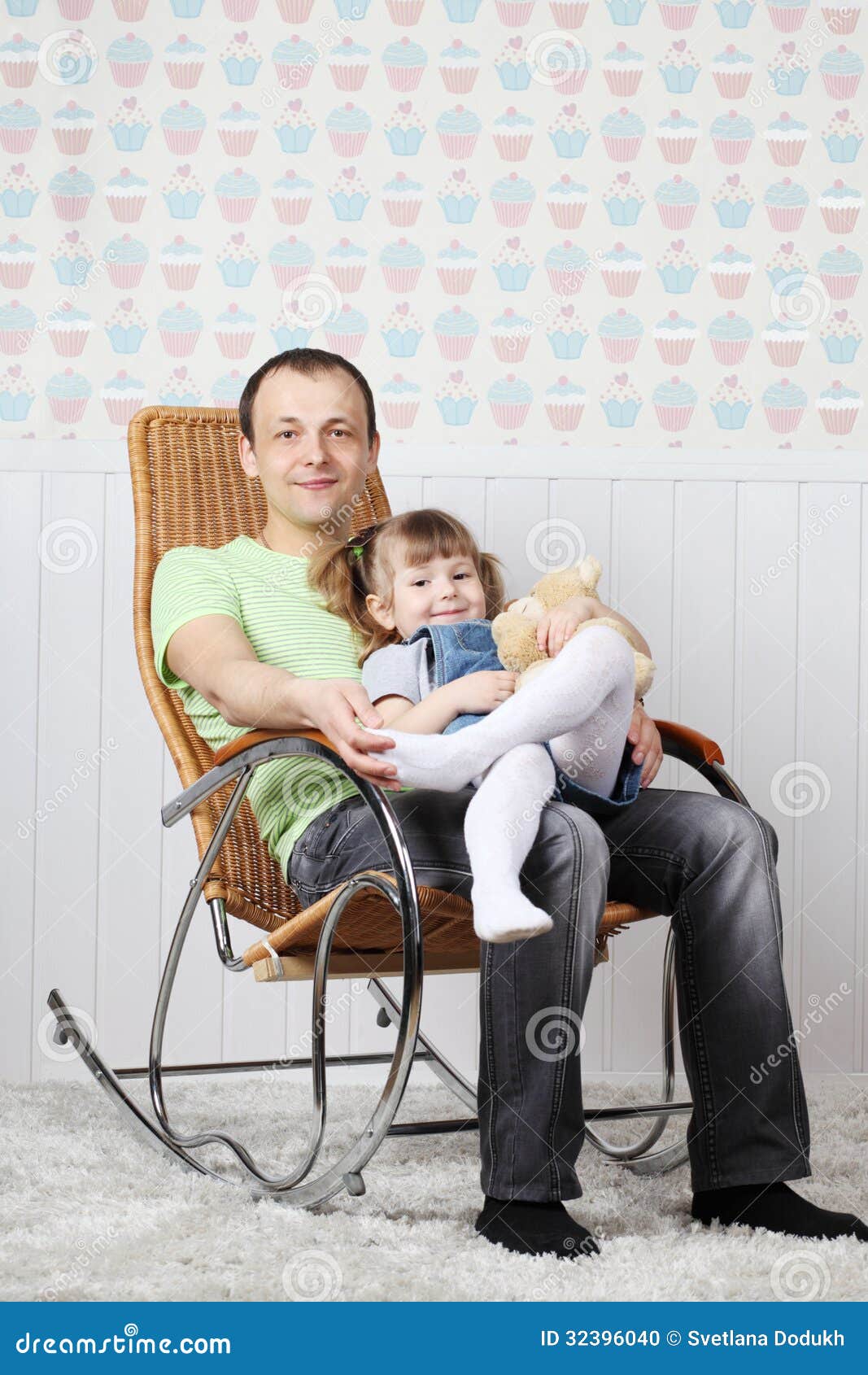 Happy Father Sits With Little Daughter In Rocking Chair ...