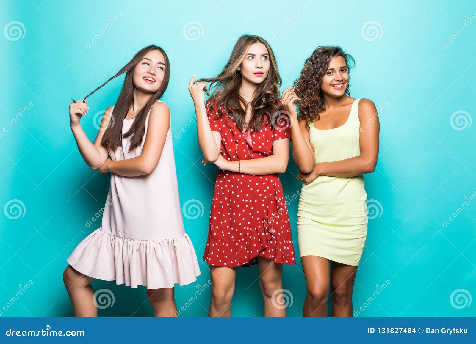 Happy Female Friends in Colourful Clothes Having Fun at Blue ...