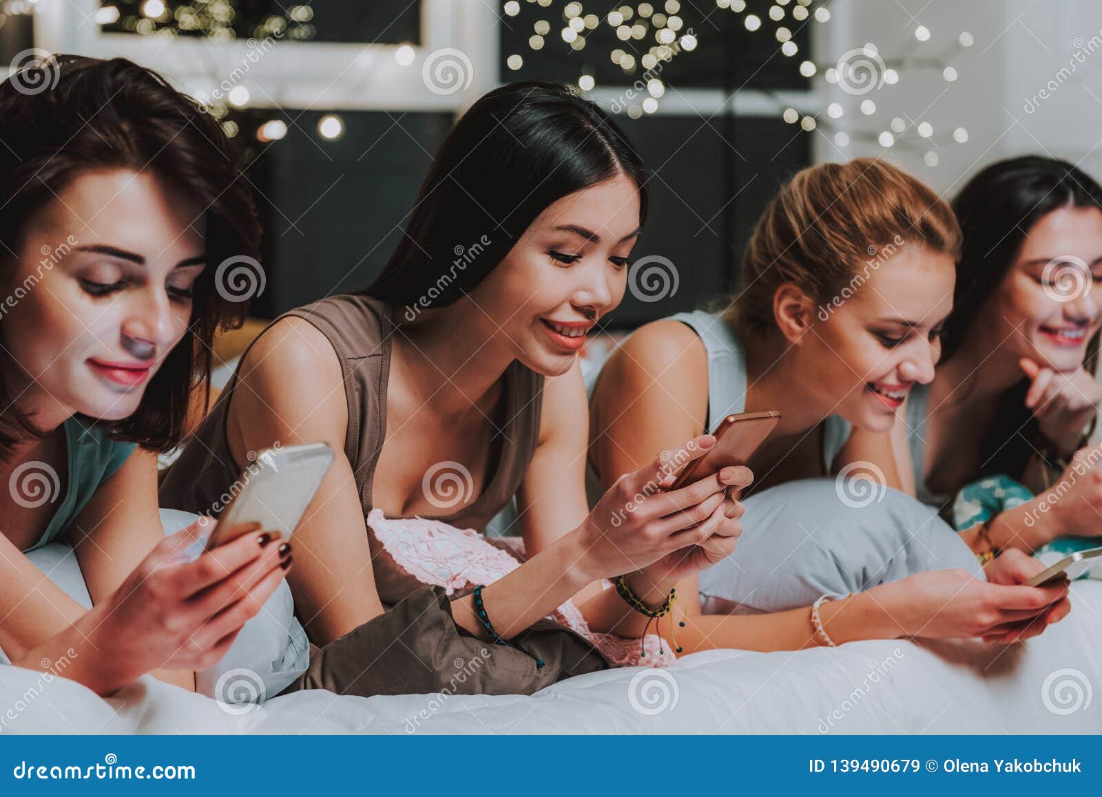 Young Women Watching At Cellphones In Room Stock Image Image Of Happy Conversation 139490679 