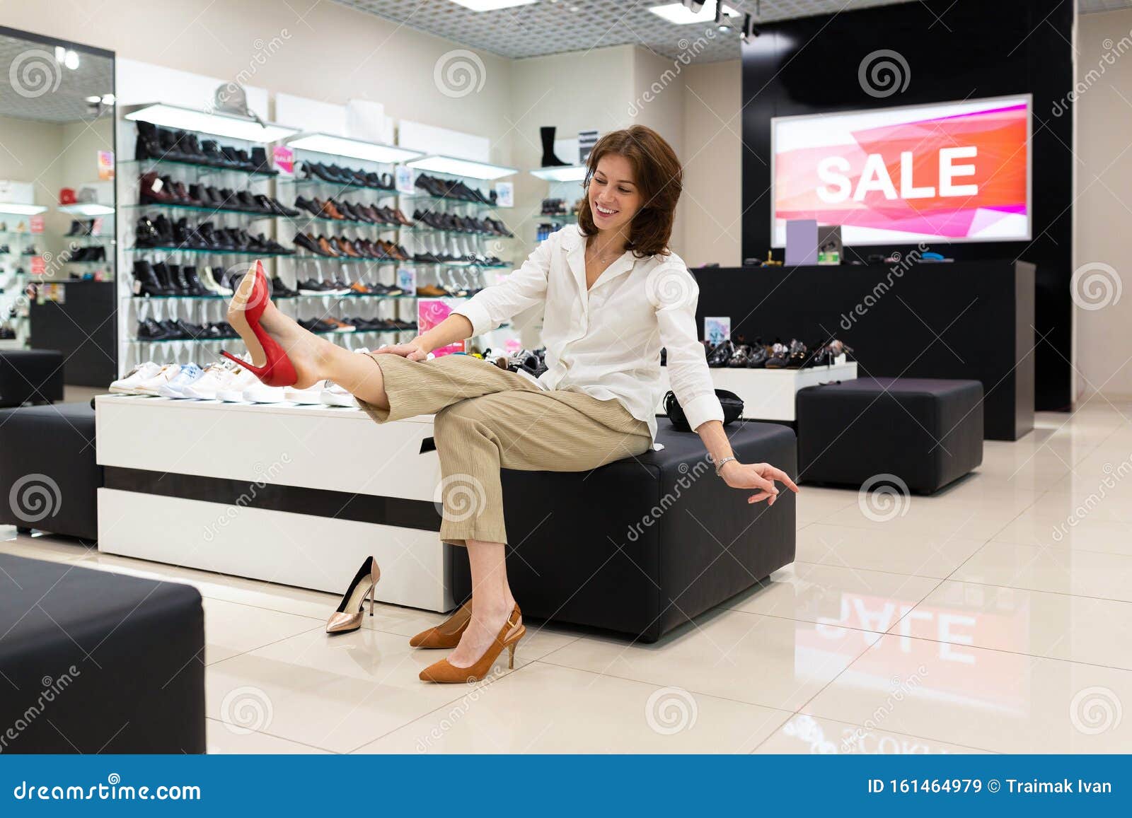 Happy Female Looks at Her New Red Shoes on High Heels. Stock Image ...
