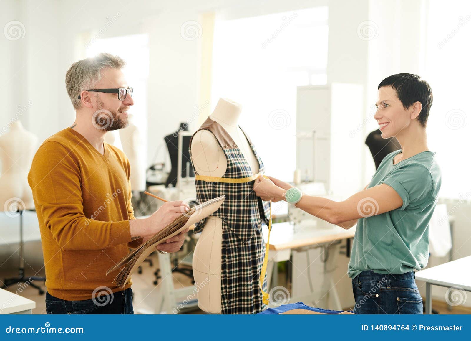 Fashion designers at work stock photo. Image of notepad - 140894764
