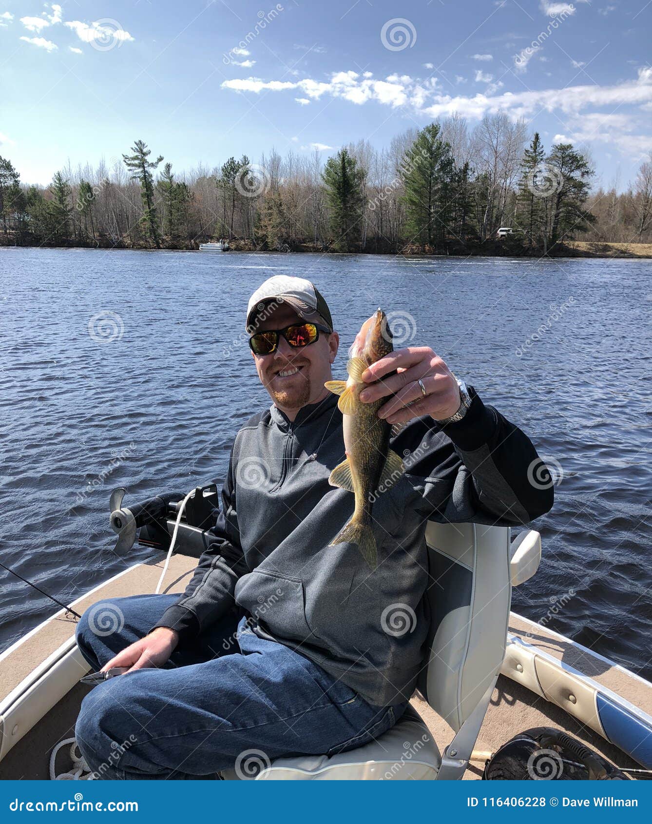 Happy Fisherman Holding Up a Caught Walleye Stock Photo - Image of happy,  boat: 116406228