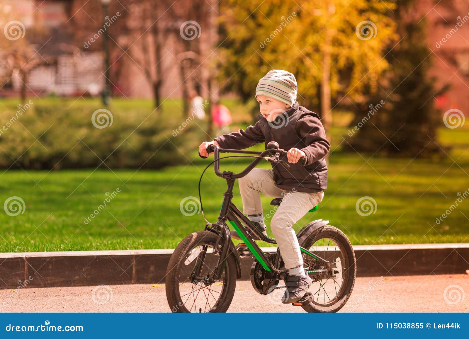 Happy Little Boy Riding a Bike Stock Image - Image of lifestyle