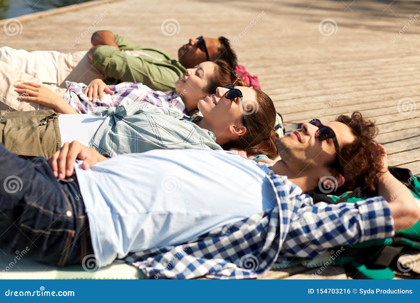 Happy Friends Chilling on Lake Pier Stock Photo - Image of indian