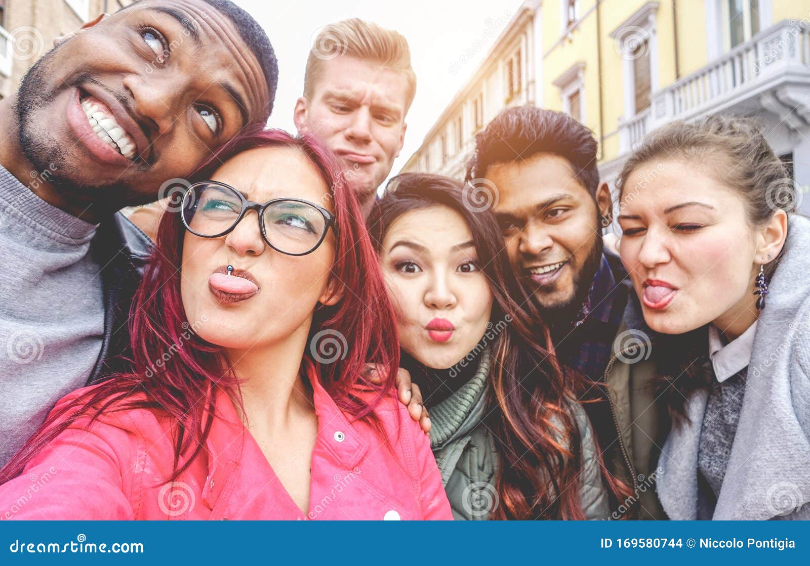 Selfie with friends. Friendly smiling teenagers making group photo