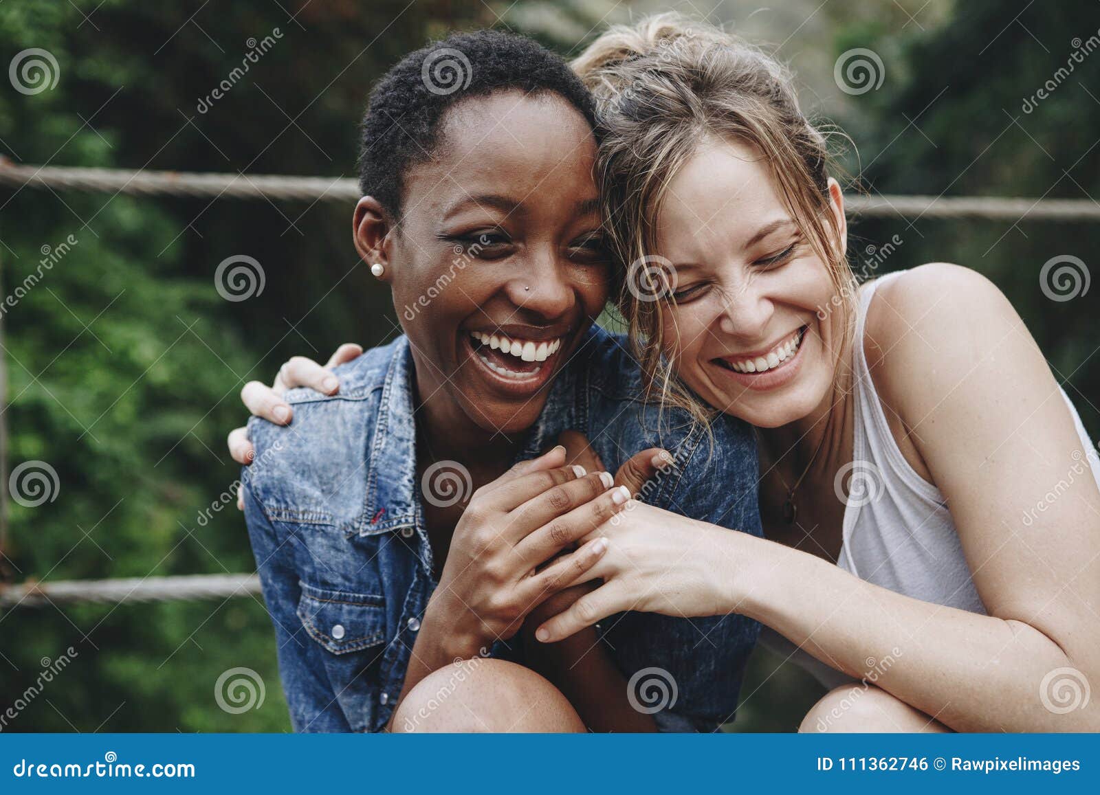 happy friends holding each other