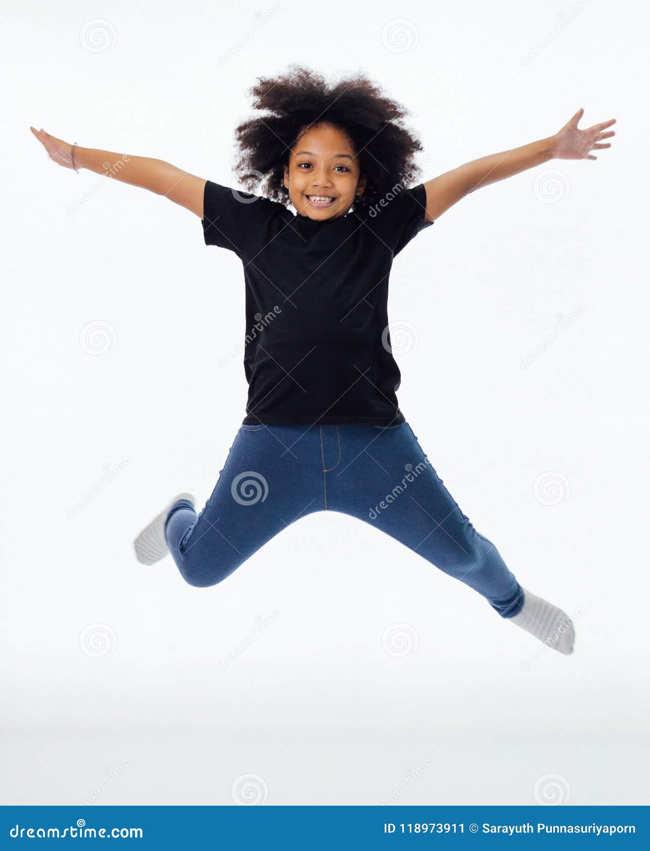 Little Africanamerican Girl Jumping Over Studio Background Stock Photo -  Download Image Now - iStock