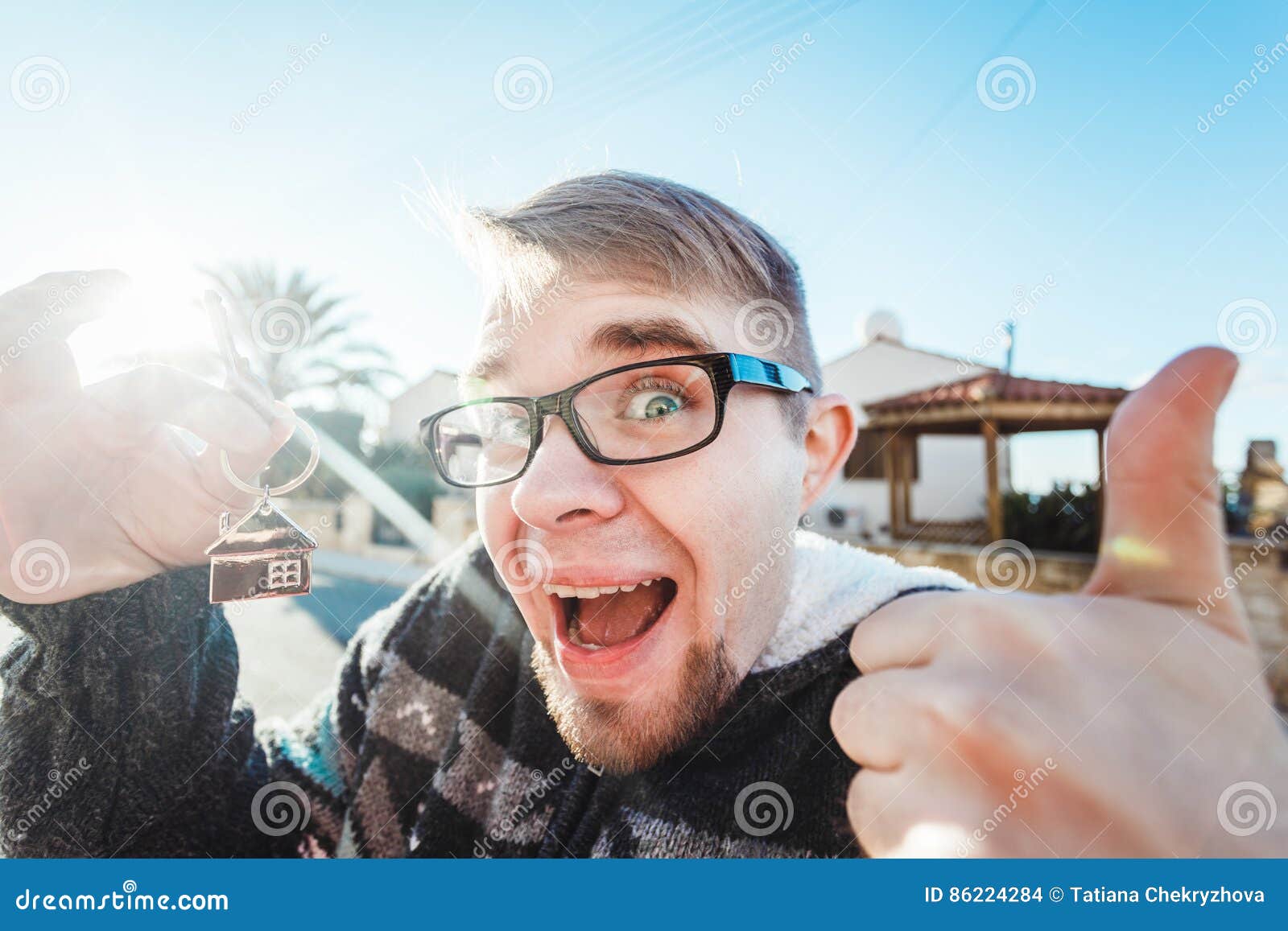 Happy Funny Man Holds House Keys on House Shaped Keychain in Front of a ...