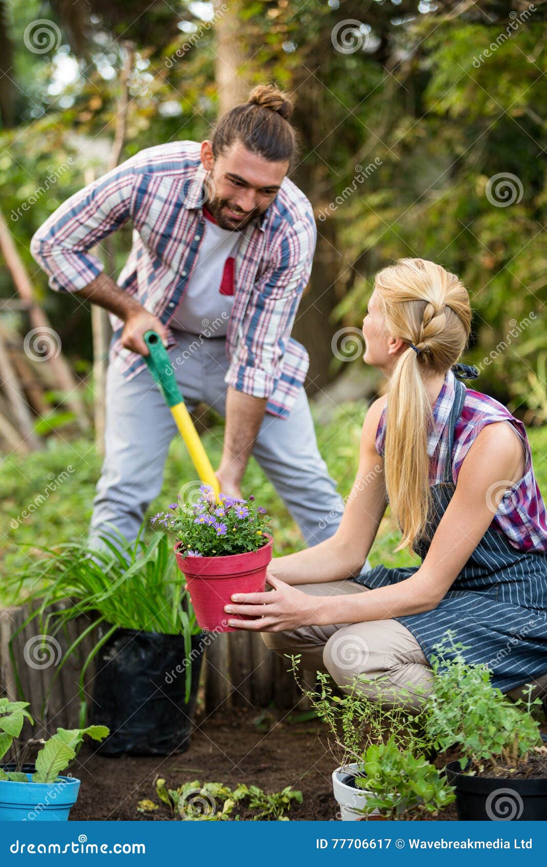 Happy Gardeners Planting Potted Plants at Garden Stock Image Image of