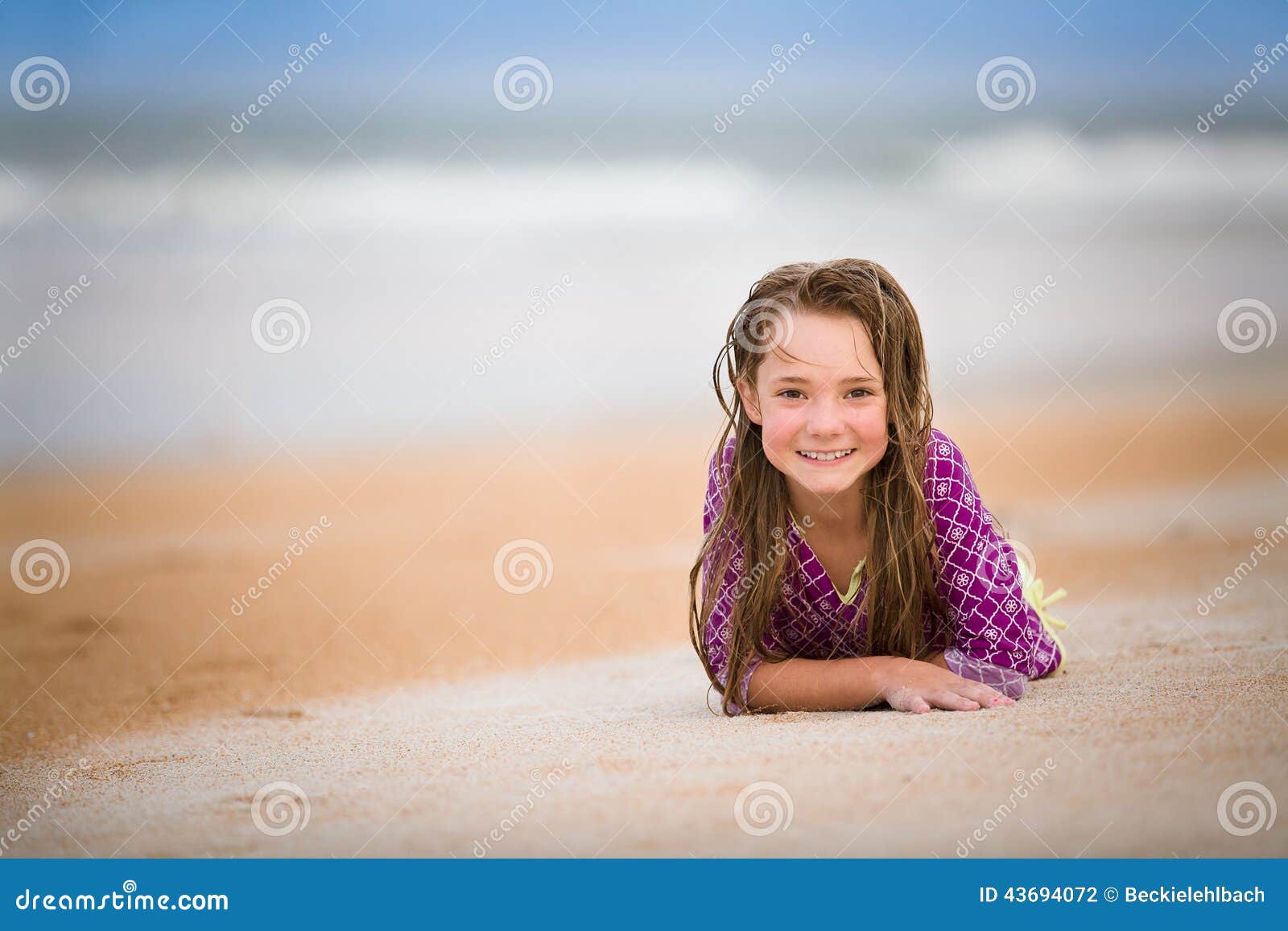 Happy girl at the beach stock photo. Image of laying - 43694072