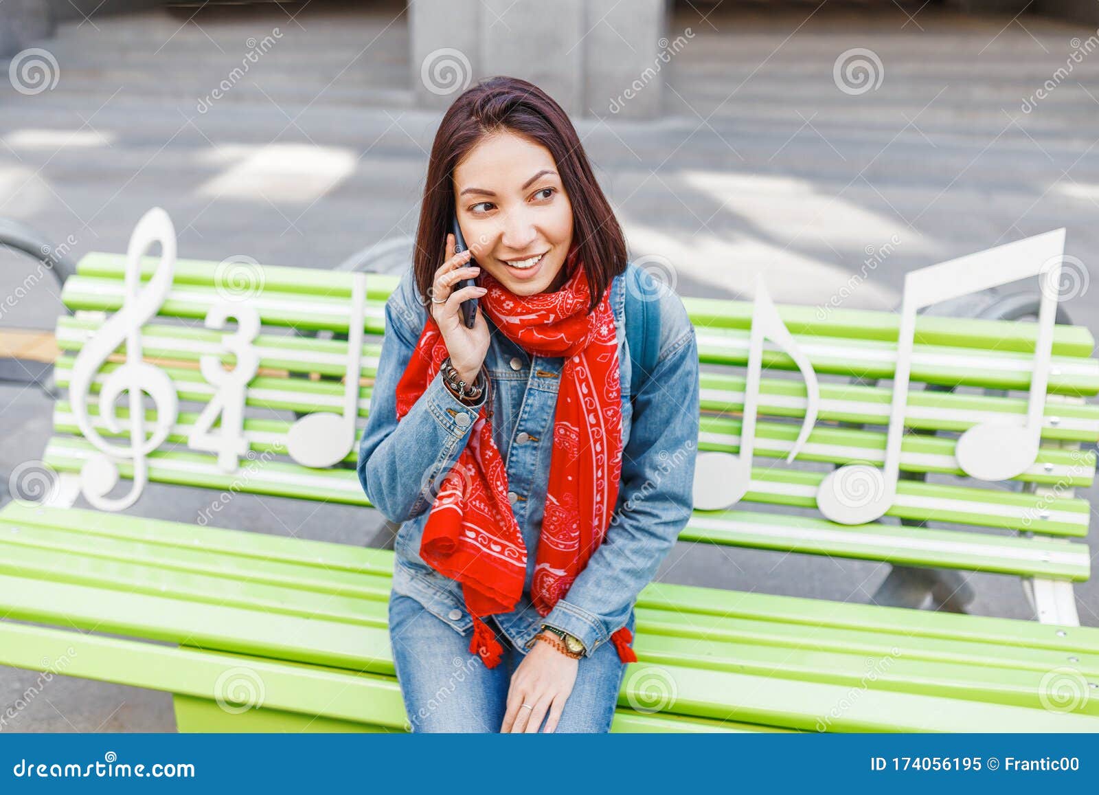 Free Photo | Vertical shot of a girl sitting on the bench 