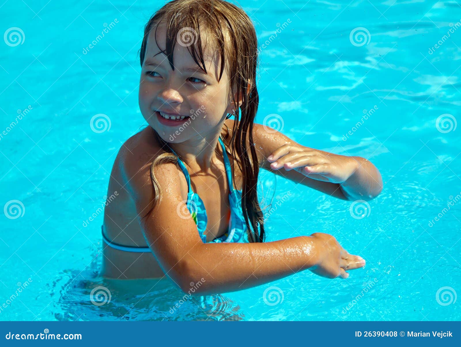 Happy girl dancing in pool stock photo. Image of smile 26390408