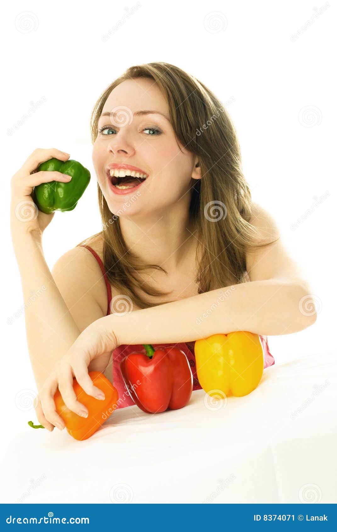 Happy girl eating peppers stock image. Image of healthy 8374071