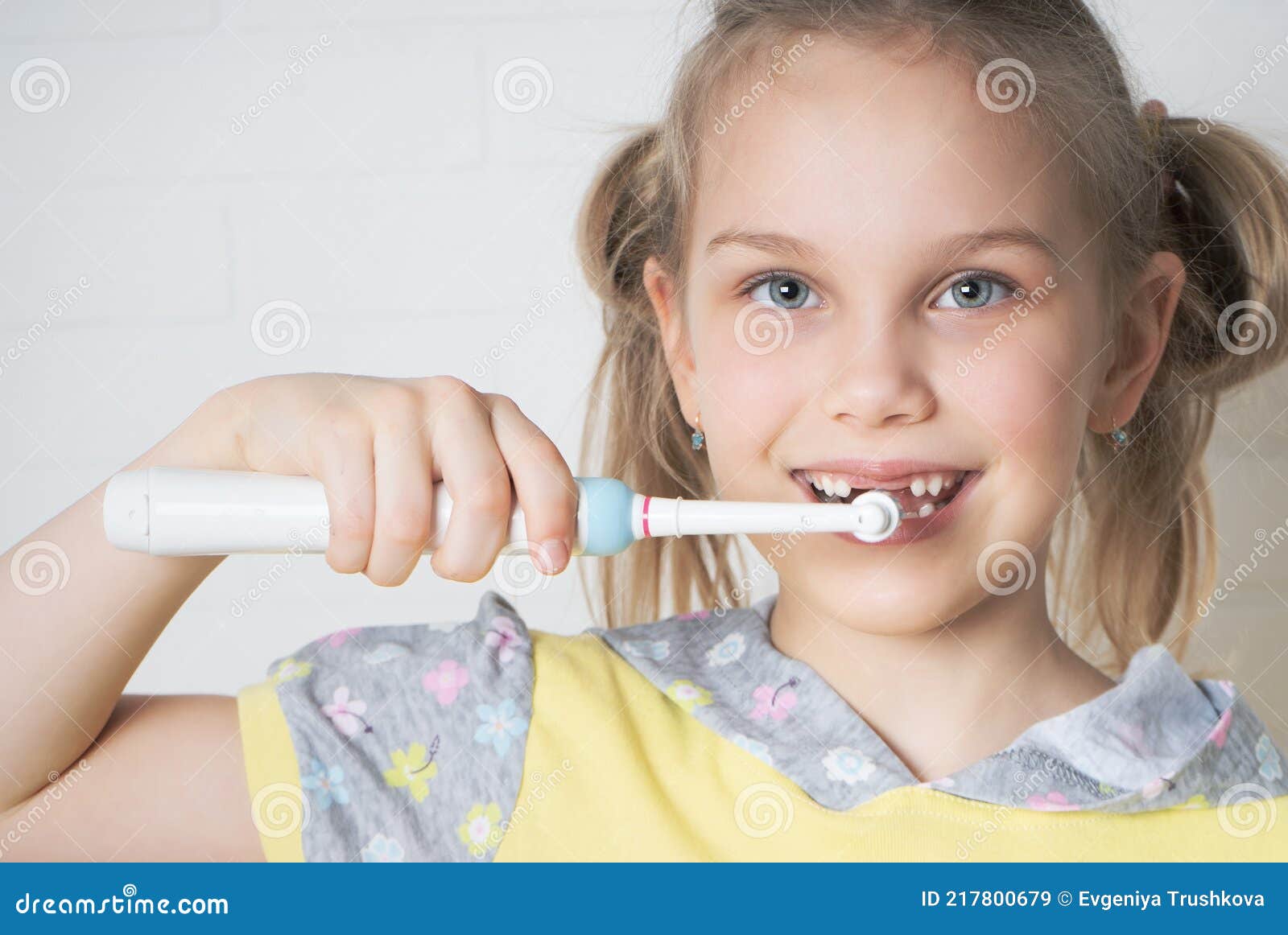 Young Girl With Electric Toothbrush