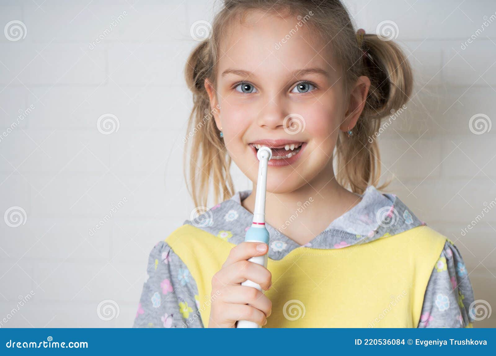 Young Girl With Electric Toothbrush