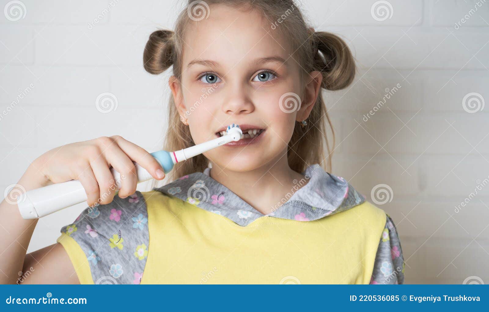 Young Girl With Electric Toothbrush