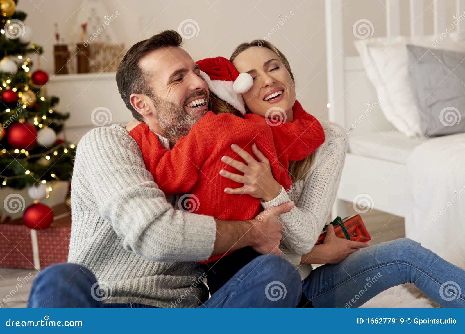 Happy Girl Embracing Her Parents Stock Image - Image of horizontal ...