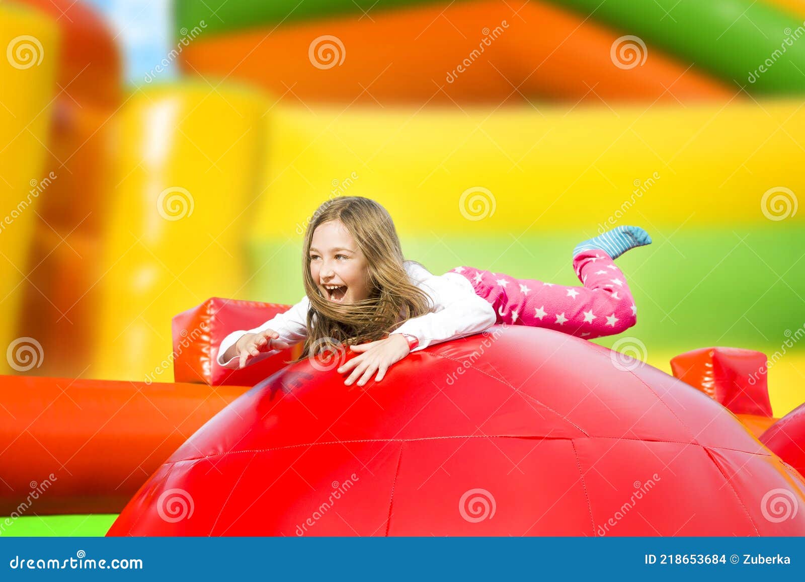happy girl on the playground inflate castle