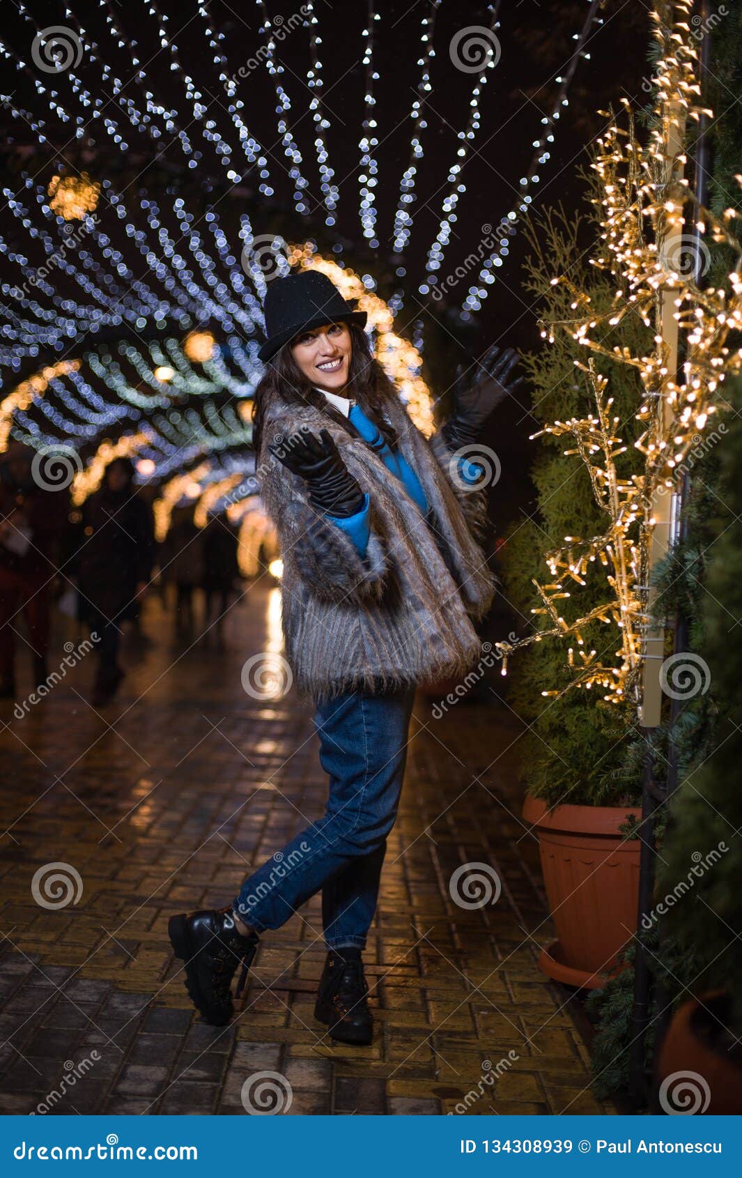 Happy Girl Posing with Winter Lights in the Background. Stock Image - Image  of city, evening: 134308939