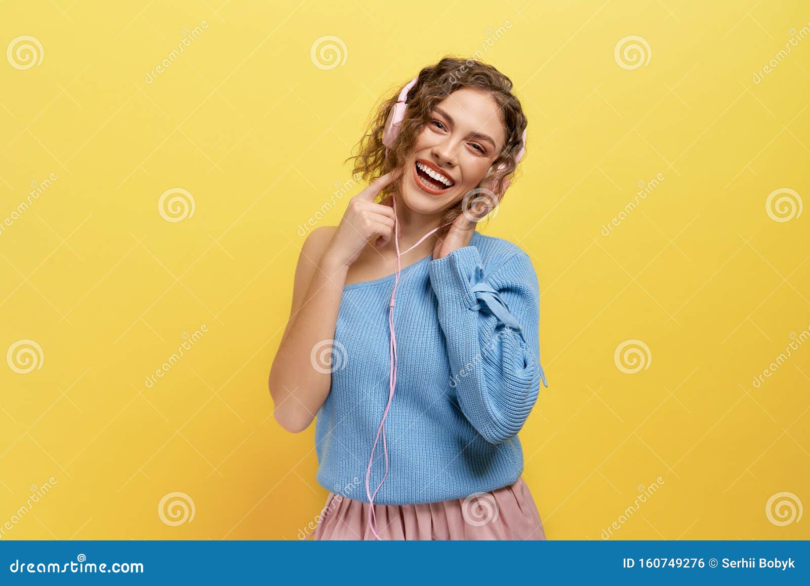 Happy Girl With Short Curly Hair Listening Music Stock Photo