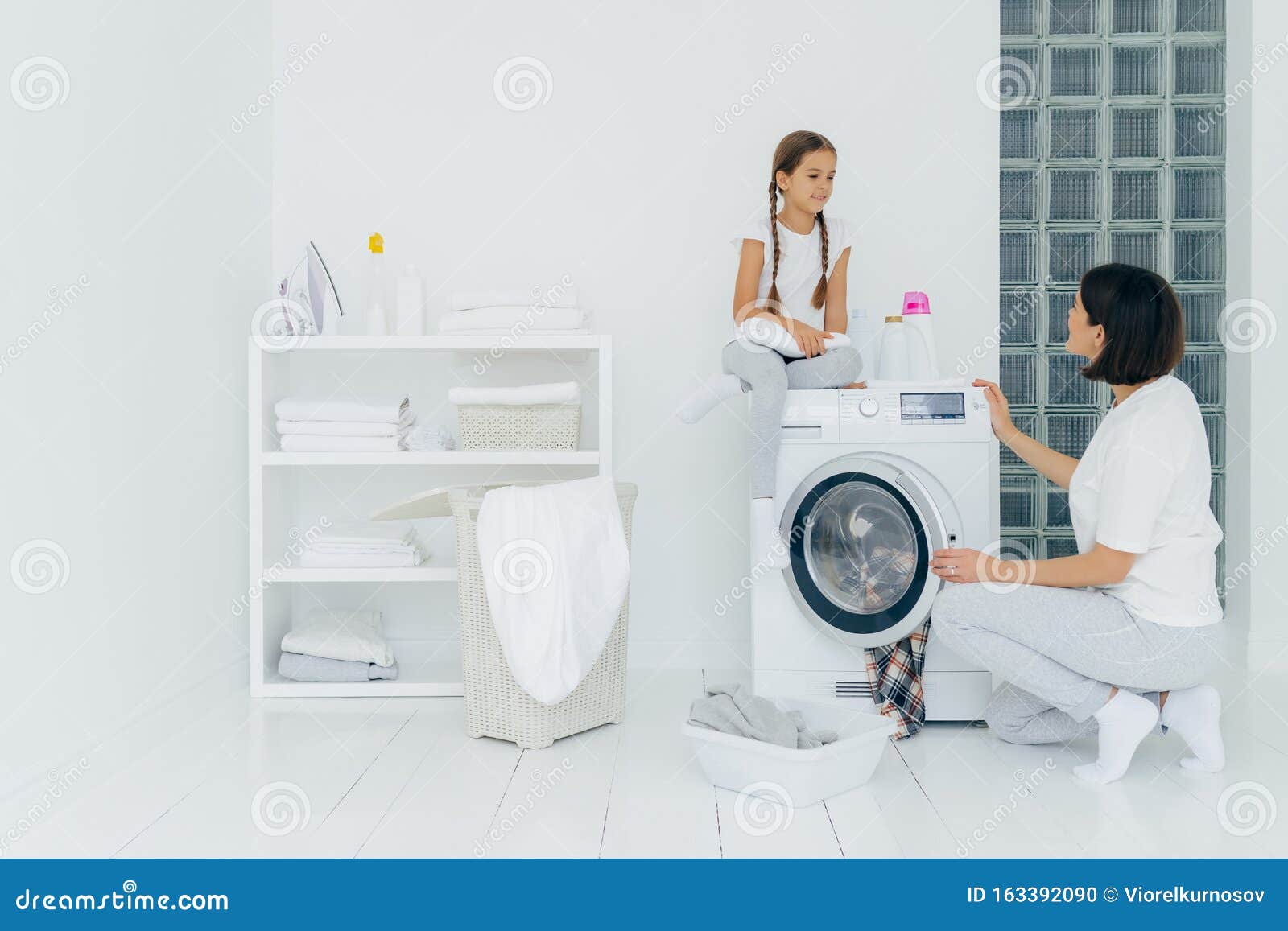 Girl Sitting On Washing Machine