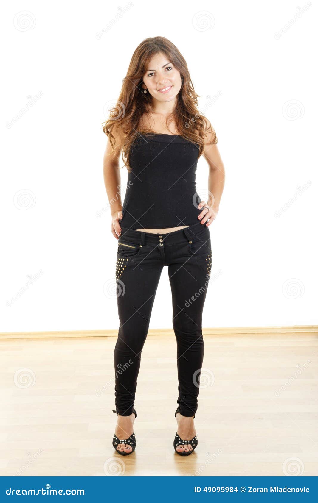 Happy Girl Standing with Hands on Hips Smiling Stock Photo - Image of ...