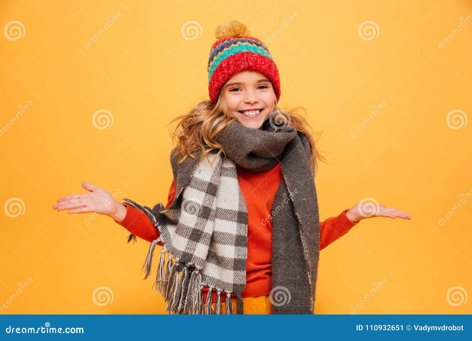 Happy Girl in Sweater, Scarf and Hat Shrugs Her Shoulders Stock Image ...