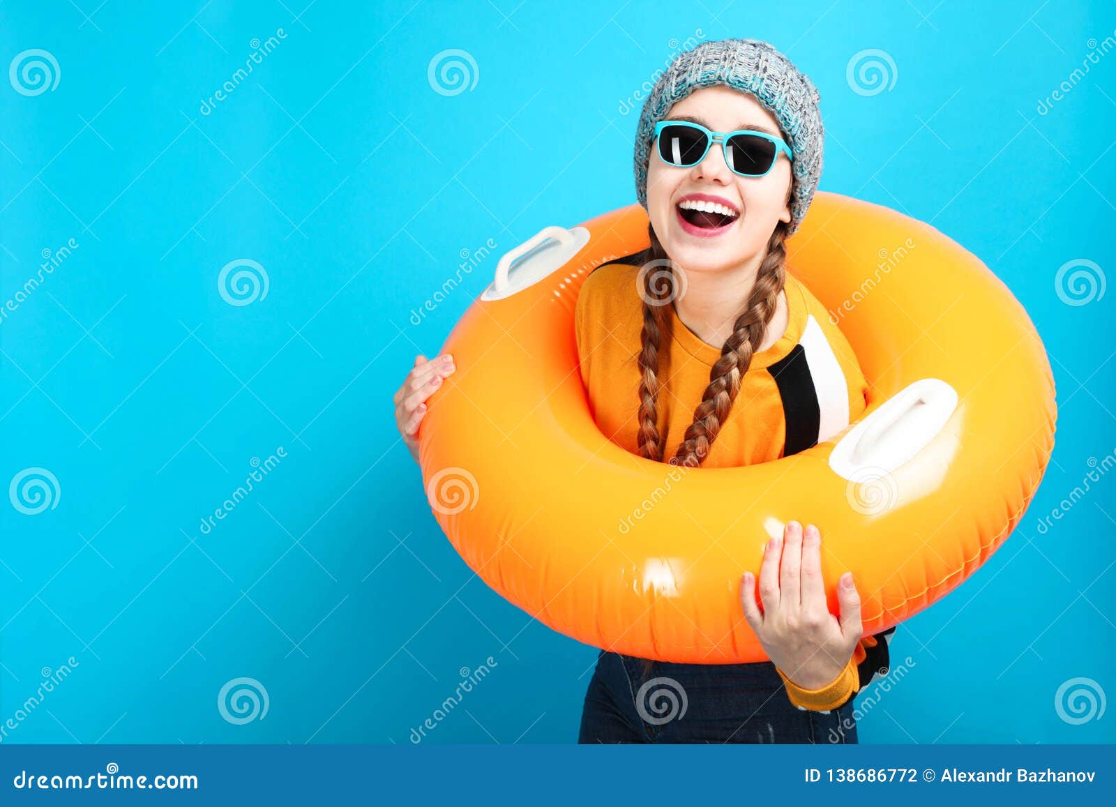 Happy Girl in Winter Clothes with Inflatable Circle Stock Photo - Image ...