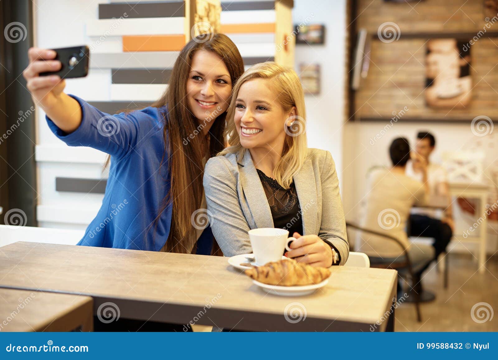 Happy girls making selfie stock photo. Image of friends - 99588432