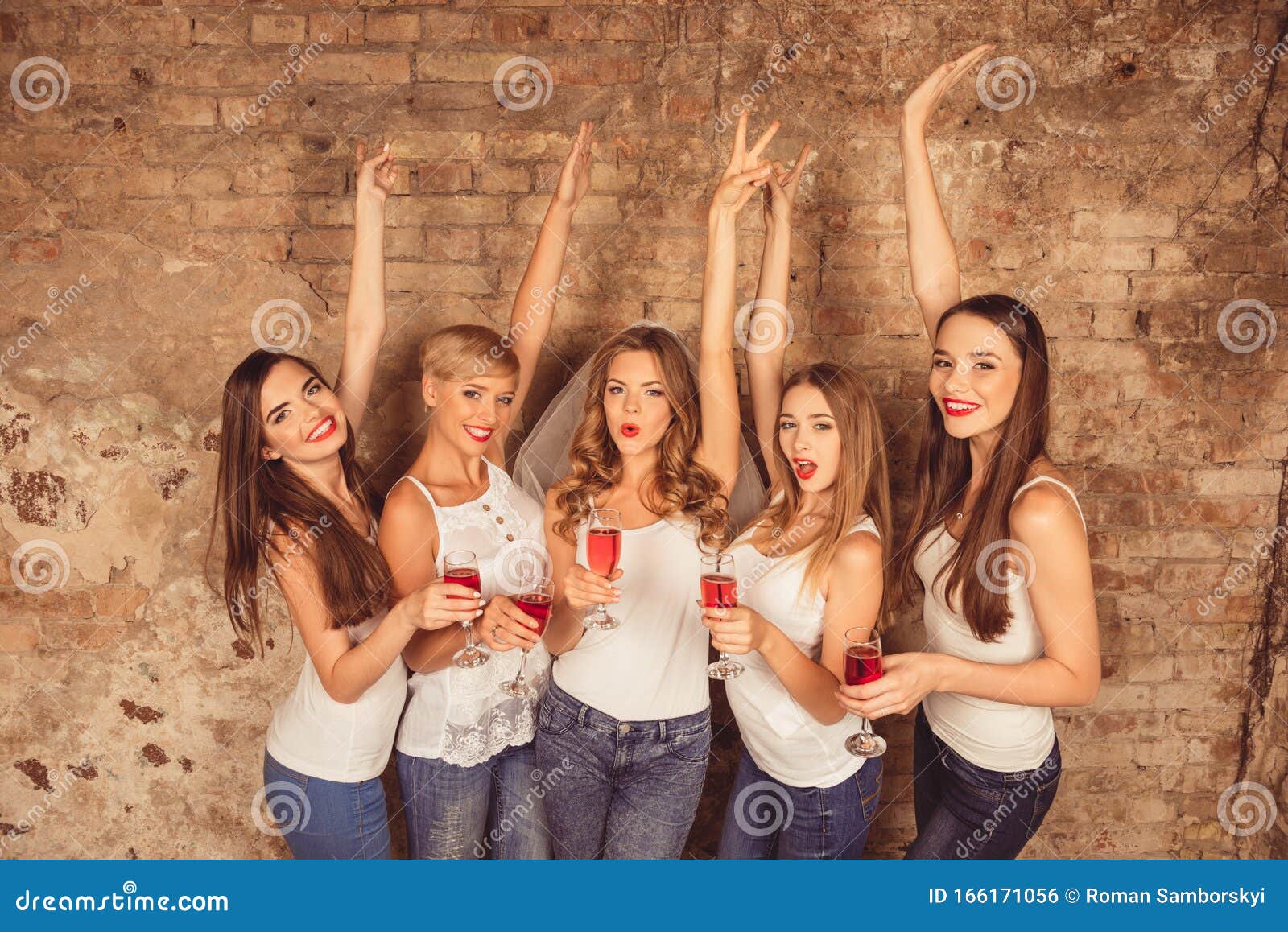 Happy Girls With Raised Hands Celebrating Bachelorette Party Of Brid