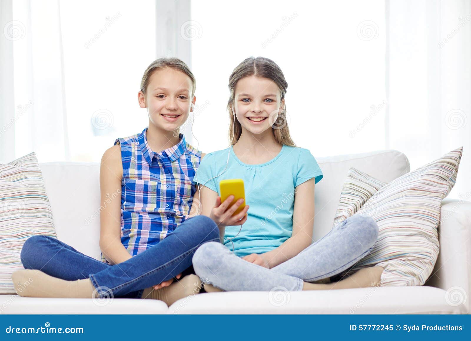 Happy Girls with Smartphone Sitting on Sofa Stock Image - Image of ...