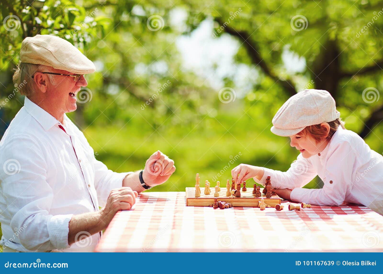 Teenager Playing Chess with his Grandfather · Free Stock Photo