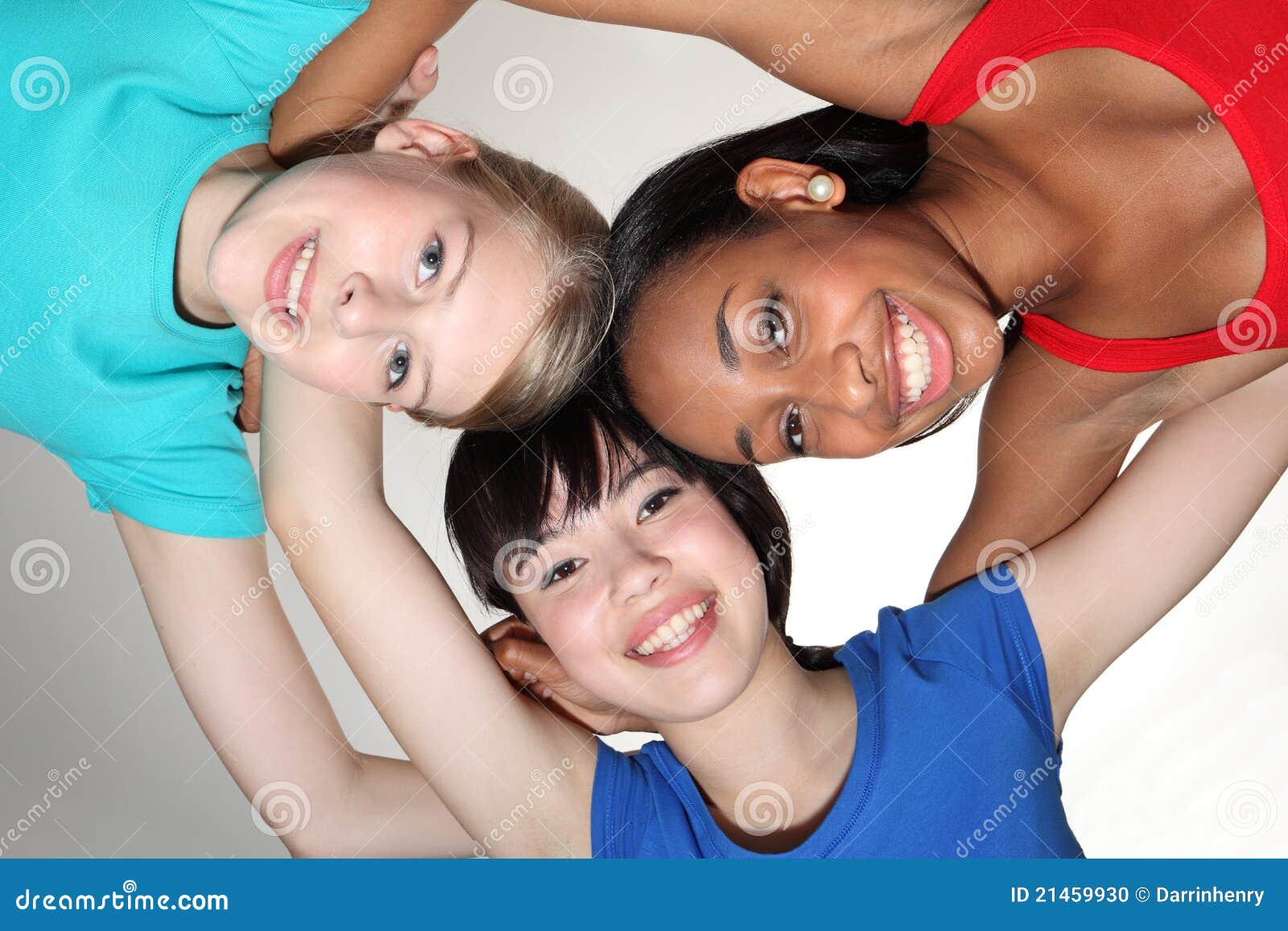 happy group huddle by mixed race student girls