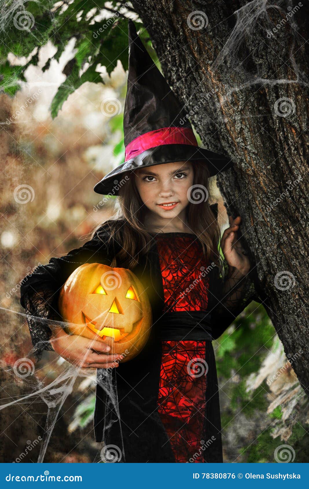 Happy Halloween. Cute Little Witch with a Pumpkin in the Hands Stock ...