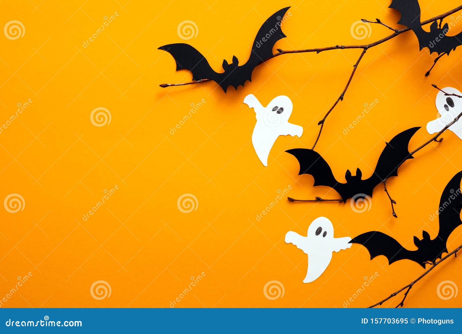 happy halloween day concept. halloween decorations, paper ghosts, bats on orange background. flat lay, top view, copy space