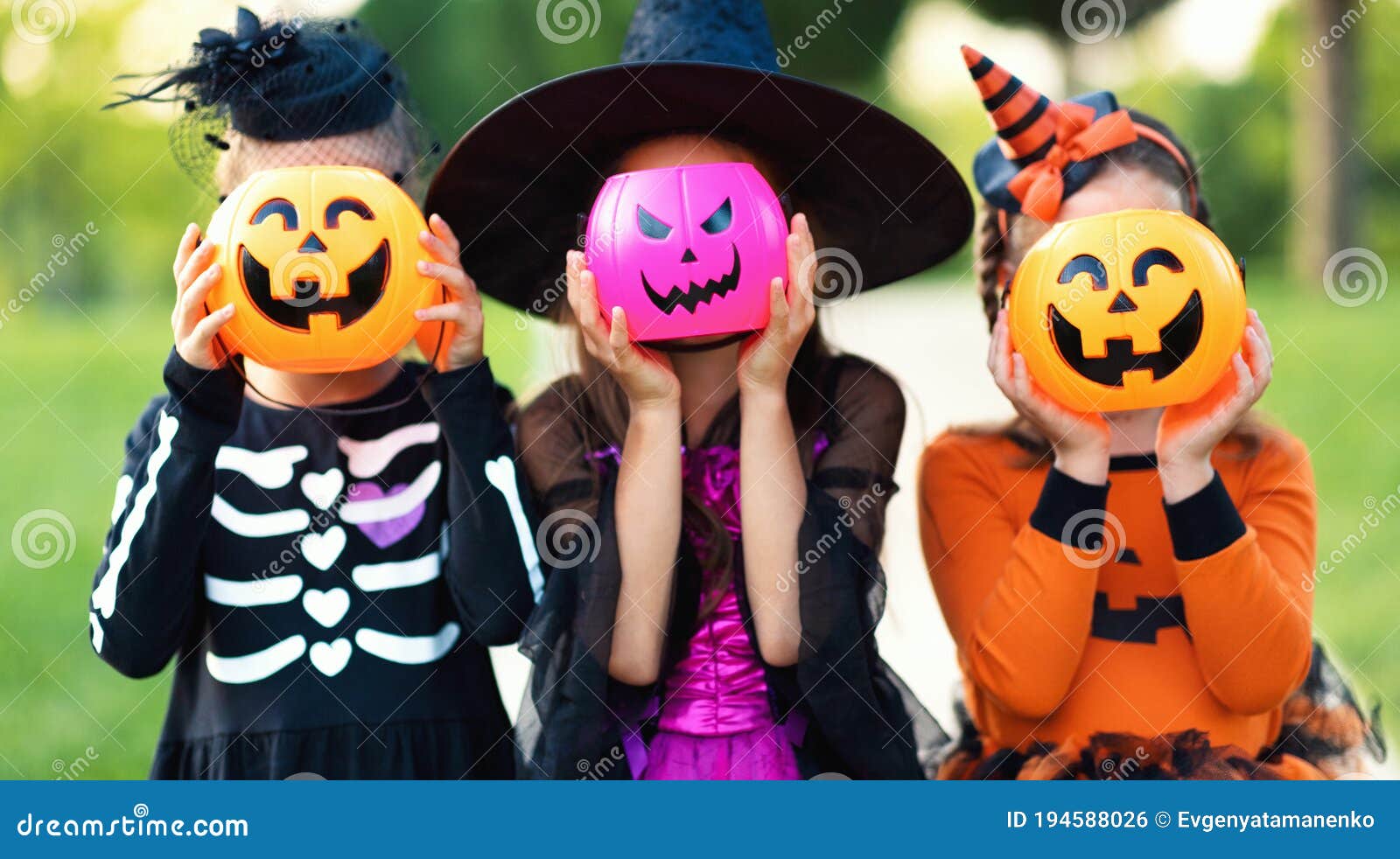 Happy Halloween! Funny Children in Carnival Costumes Hide Their Heads  Behind Buckets Pumpkins Outdoors Stock Photo - Image of carnival,  halloween: 194588026