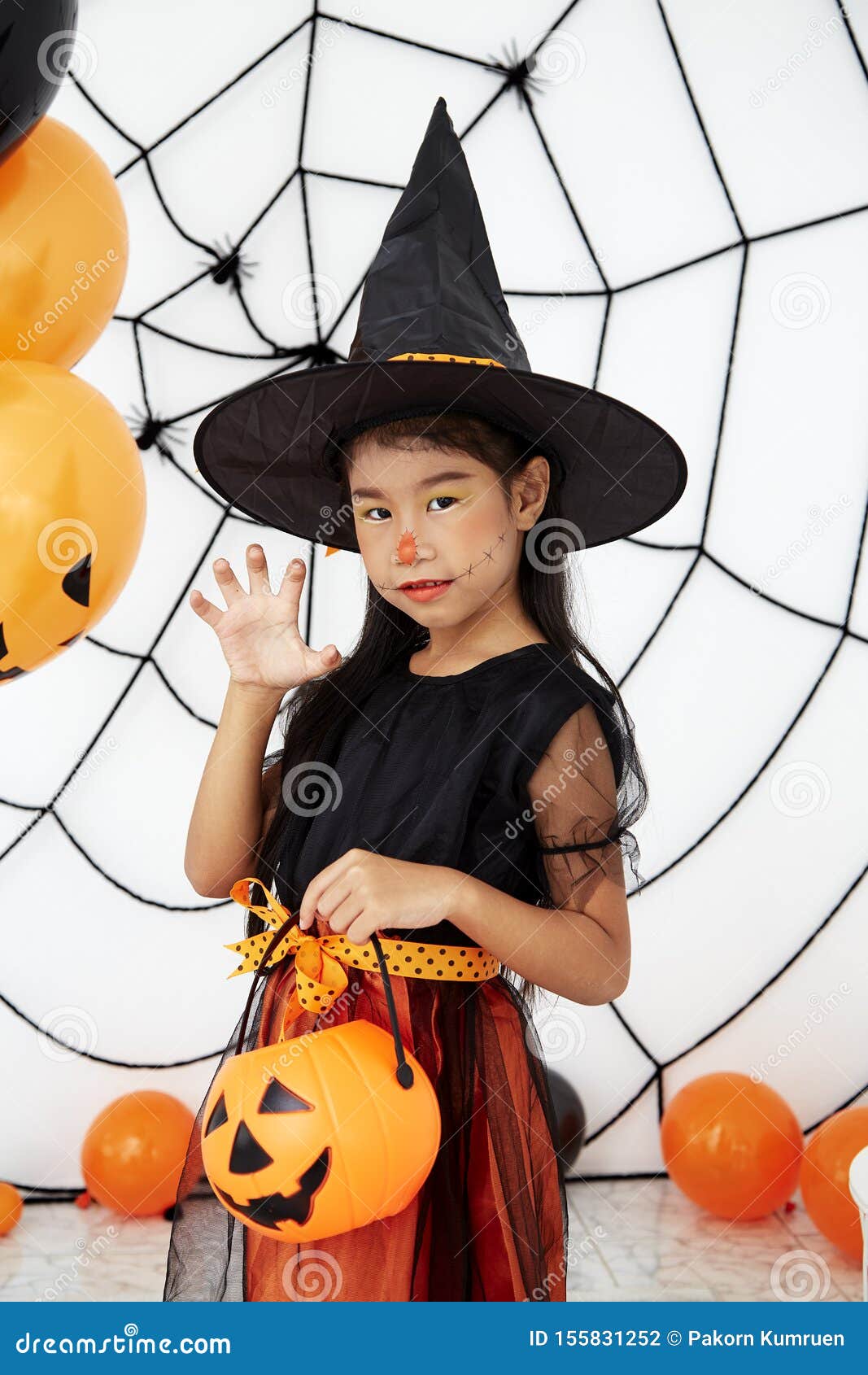 Download Happy Halloween Little Witch With A Pumpkin Stock Photo ...