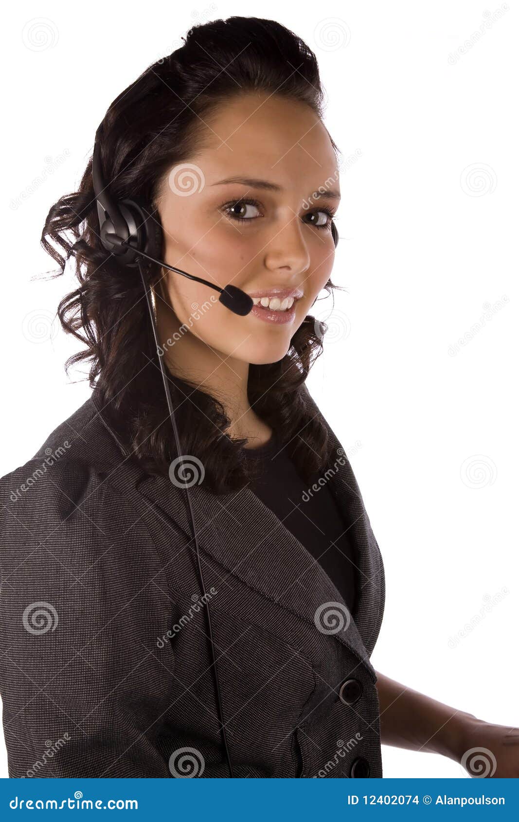 Happy headset. A close up of a woman s face with a headset with a small smile on her face.