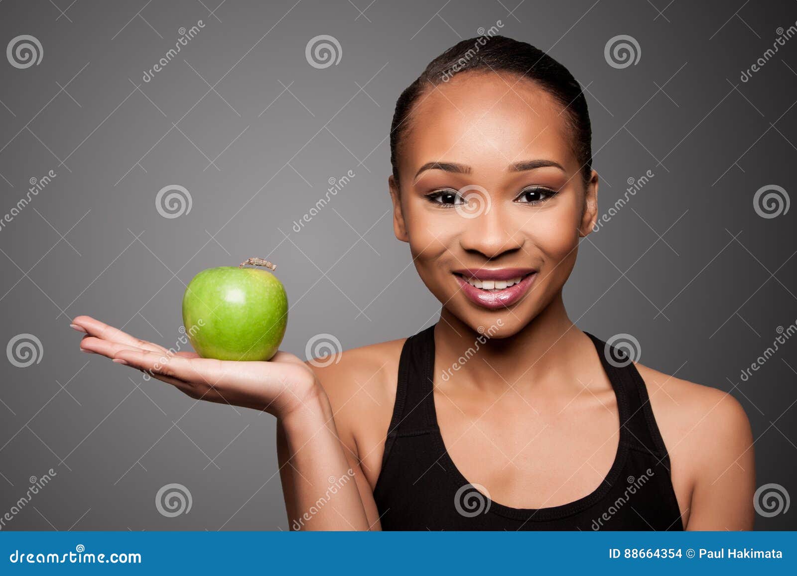 Beautiful healthy happy smiling black asian woman with dumbbell