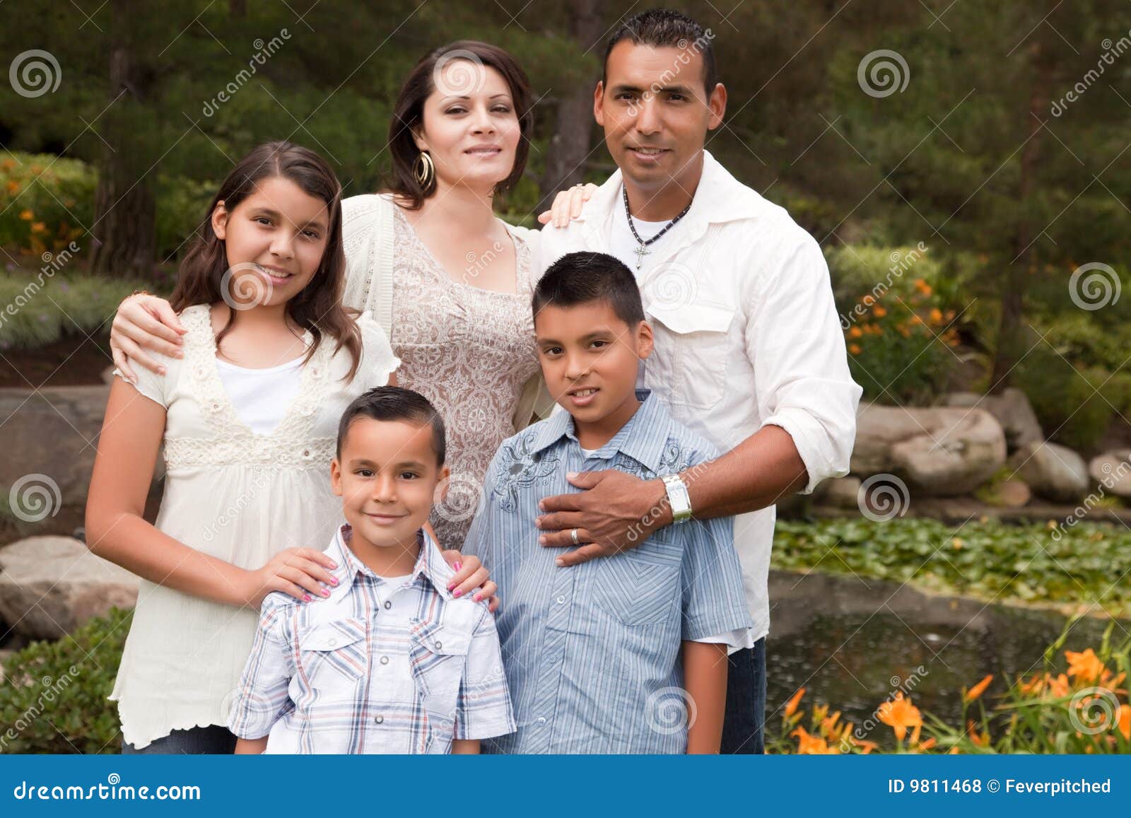 Happy Hispanic Family In The Park Royalty Free Stock Photos - Image