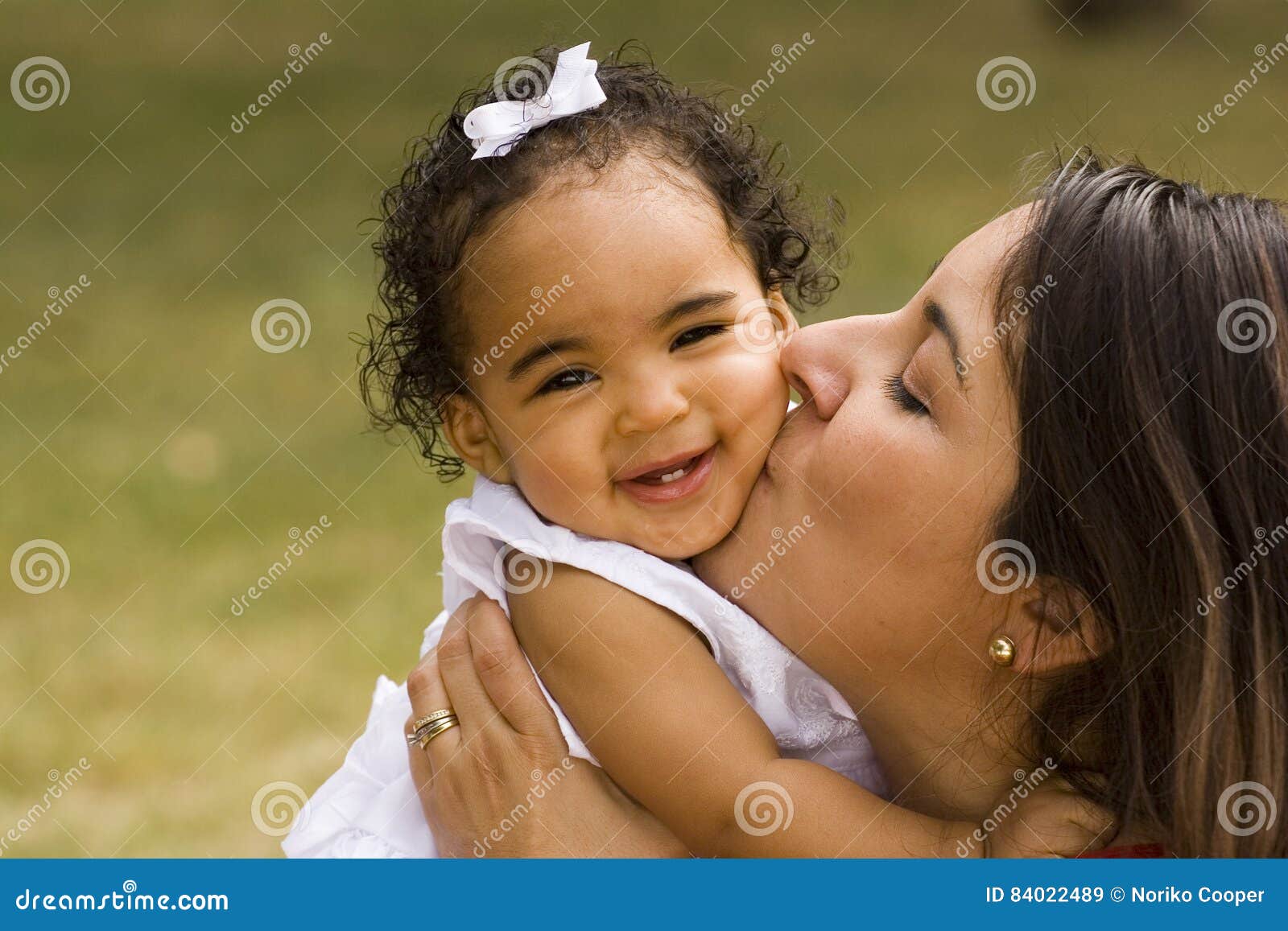 happy hispanic mother and her little girl.