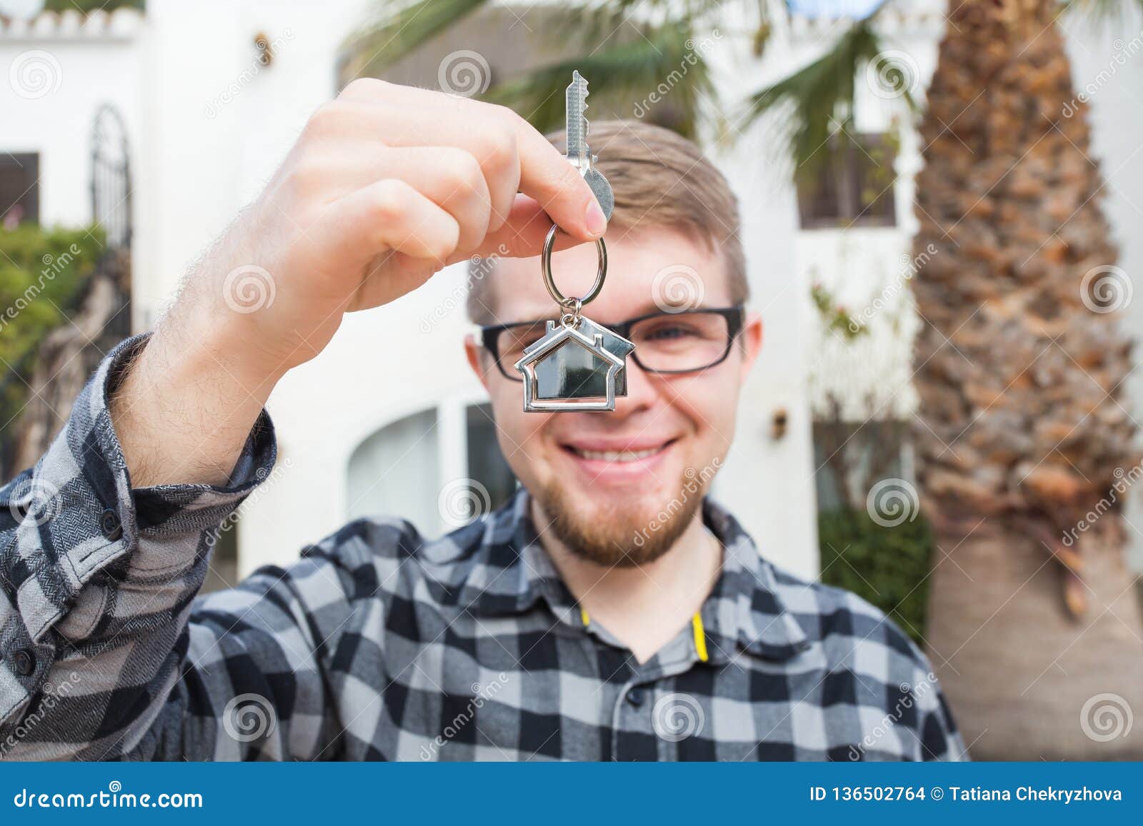 Happy House Owner. Smiling Young Man Holding Keys and Looking at Camera ...